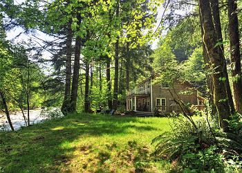 Two Rivers Cottage is a dream come true for dogs with 4 private acres at the end of the road along the Salmon River.