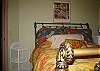 downstairs bedroom w/ queen bed