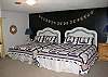 bedroom w/ queen and double size beds