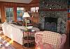 living room with wood burning fireplace