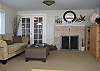 Living room area with wood burning fireplace