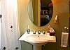 Both baths, one upstairs, one down are full bathrooms with a laundry area next to the downstairs bath. .