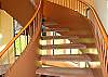 The sweeping staircase is not the only unique grandure of this beach house!