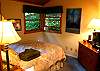 The sweet entry level bedroom with forest views, skylight, and sm. HDTV/cable