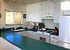 The kitchen  is open and bright and has every amenity to create culinary delights with friends and family.