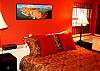 The downstairs bedroom is cozy and inviting