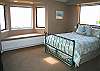The master suite has a private bath with a Jacuzzi bathtub.
