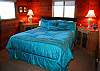 The master bedroom is cozy and comfortable with knotty wood walls and ceilings...Imagine a charming "beach cabin!"