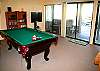 You will LOVE this game room...Flat screen TV, Queen sofa sleeper, sliding doors opening to the patio and hot tub,and of course...the  POOL Table!
