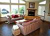 The open floor plan is perfect for family and friend get-togethers. The living room has stunning ocean views, is open yet cozy with the gas/log fireplace.