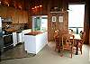 Kitchen and dining areas with slider to the wrap around deck...