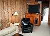 Large screen TV, Blueray, DVD, Movies, Playstation, Board games inside entertainment center.