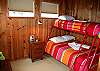 The second bedroom, bright and open with ocean views