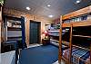 2nd Bedroom- 2 Sets of Bunk Beds (single over single) - TV (Ground Floor) - Access to patio under the deck off the Main Living Space upstairs