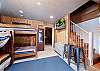 2nd Bedroom- 2 Sets of Bunk Beds (single over single) - TV (Ground Floor) - Access to patio under the deck off the Main Living Space upstairs (3 Bedroom Cabin) 