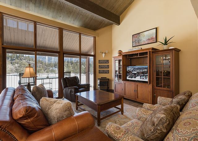 Living Room with Ample Seating, Large Windows for Natural Light, Fireplace and TV