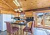 Breakfast Bar, Fully Equipped Kitchen, and Views of the Mountains and Green Space