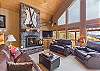 Living Room - Rustic Cabin Decor and Fireplace with Large Windows for Natural Light