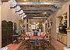 Stunning Interior Design with Antique Doors, Wooden Beams, Viga and Latilla Ceilings, Kiva Fireplaces, and Earthen Plaster Walls of our Home Define the True Santa Fe Architectural Style