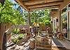 Outdoor Living Space with Comfortable Seating, Dining, and Fireplace