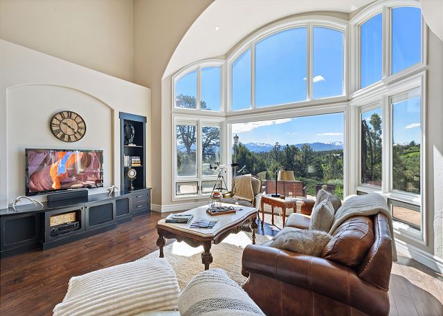 Living Room with Large Windows for Mountain Views and Natural Lighting - TV