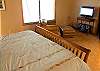 This bedroom also has a flat screen TV