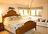 This main floor bedroom features a King Bed, love seat, TV, DVD.  The bath with shower also has a door to the hallway. The master has access door to the hot tub.