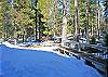 There is a spacious deck with ample bench seating under all of this snow!  When the snow melts there will be beautiful deck furniture put out for your family to enjoy.