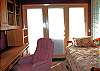 Right down the hall from the kitchen is this office with a Twin Trundle bed and door to the deck.
