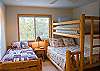 Great space for kids! This bedroom has another door leading to another bonus area with two  more twins and a TV.