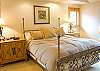 Upstairs Master with a king bed.  Also has a double sided fireplace shared with the master bath.  Flat screen TV.