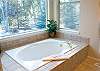 Beautiful Master Bathroom features a spacious new garden tub, separate shower, and double sinks.