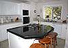 More seating at this breakfast bar in the fully equipped kitchen!
