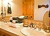 Upstairs Hall Bathroom with Tub/shower and 2 sinks.  This bathroom is shared by the Bunk and Queen Room.