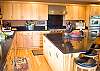 Another view of this fully stocked kitchen!