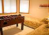Great kid's room downstairs with twin beds and foosball table!