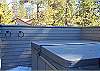 There is access to the deck and the hot tub off of the kitchen/dining area as well as the hallway that leads to the master bedroom.
