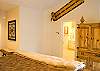 The spacious master suite features a King Size Bed with a lofty pillow-top mattress.  Also features a door leading to the private hot tub outside.