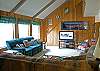 Plenty of seating for watching the game or a movie on the flat screen tv.
