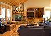 Beautiful stone fireplace is warm and inviting.