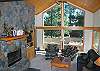 Living room with view.  Beautiful stone
gas fireplace and pine wood.  Living room has TV, DVD/VHS and stereo.
