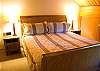 King Bedroom Suite upstairs in the separate unit.  Has bath with shower and opens to small living and kitchen area.