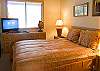 This downstairs Master Bedroom has a Queen Size Bed with a flat screen T.V.