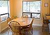 Enjoy the views from this dining room.  You can also stroll out the door to the hot tub and enjoy a soak.