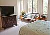 Upstairs Queen Room with a new flat screen t.v. and Sleeper Sofa along with an ipod docking staiton.