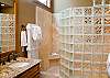 This Upstairs Master Bath has a huge walk in shower with a rain shower head and heated towel rack.