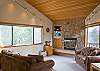 Nice and comfortable couches provide room for the entire family to sit around the wood burning fire.