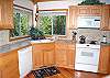 Kitchen has a breakfast bar and newer appliances.