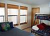 Downstairs bedroom has a Full Size Bed and Pyramid Bunk beds with a Full Size Bed on the bottom and Twin on top. Has a  TV, DVD and VHS.