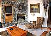 This home is warm and inviting. It has the upscale feel of Sunriver with great views out the wall of windows.